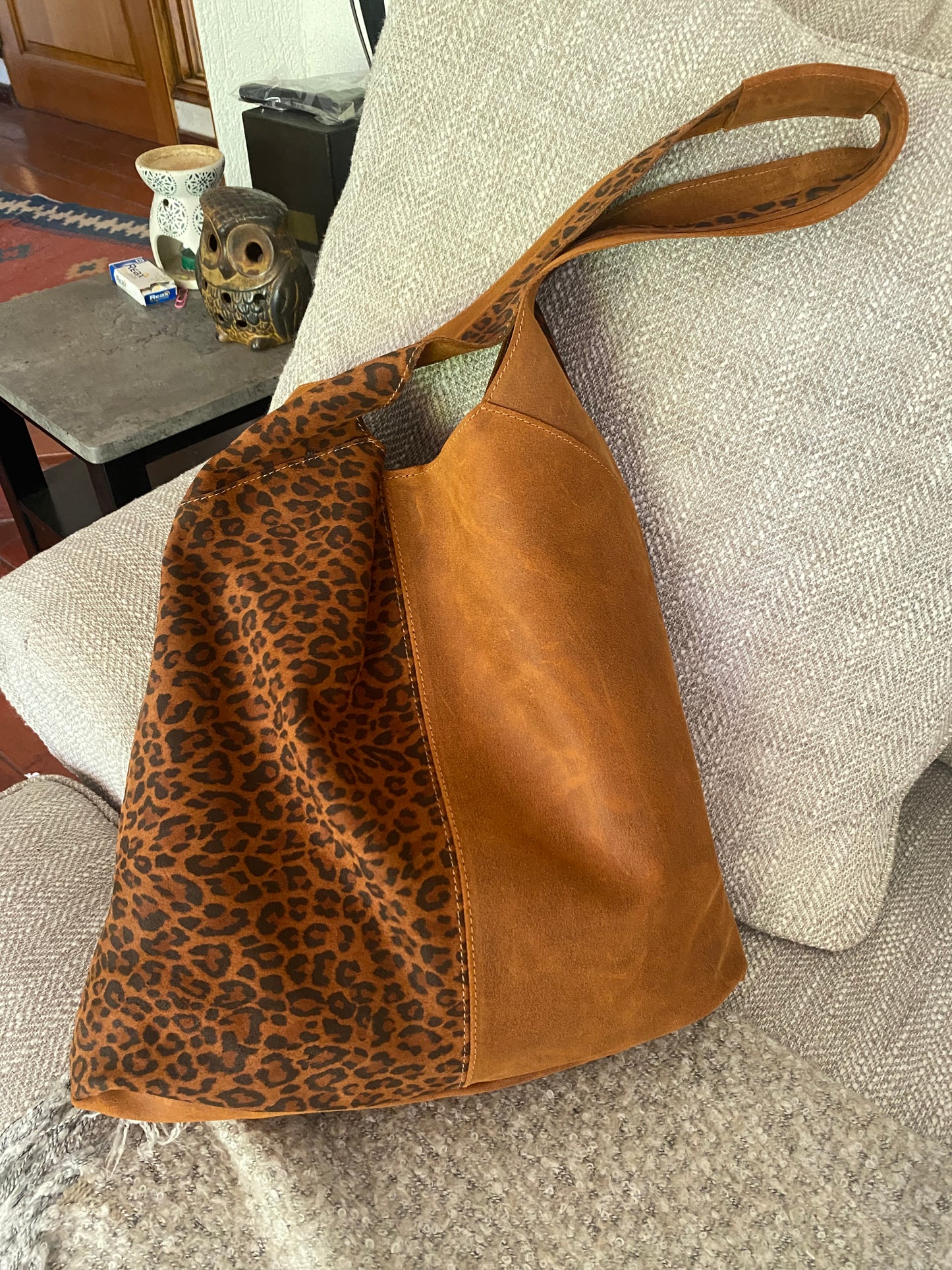 Cartera Renate cuero grasso y animal print
